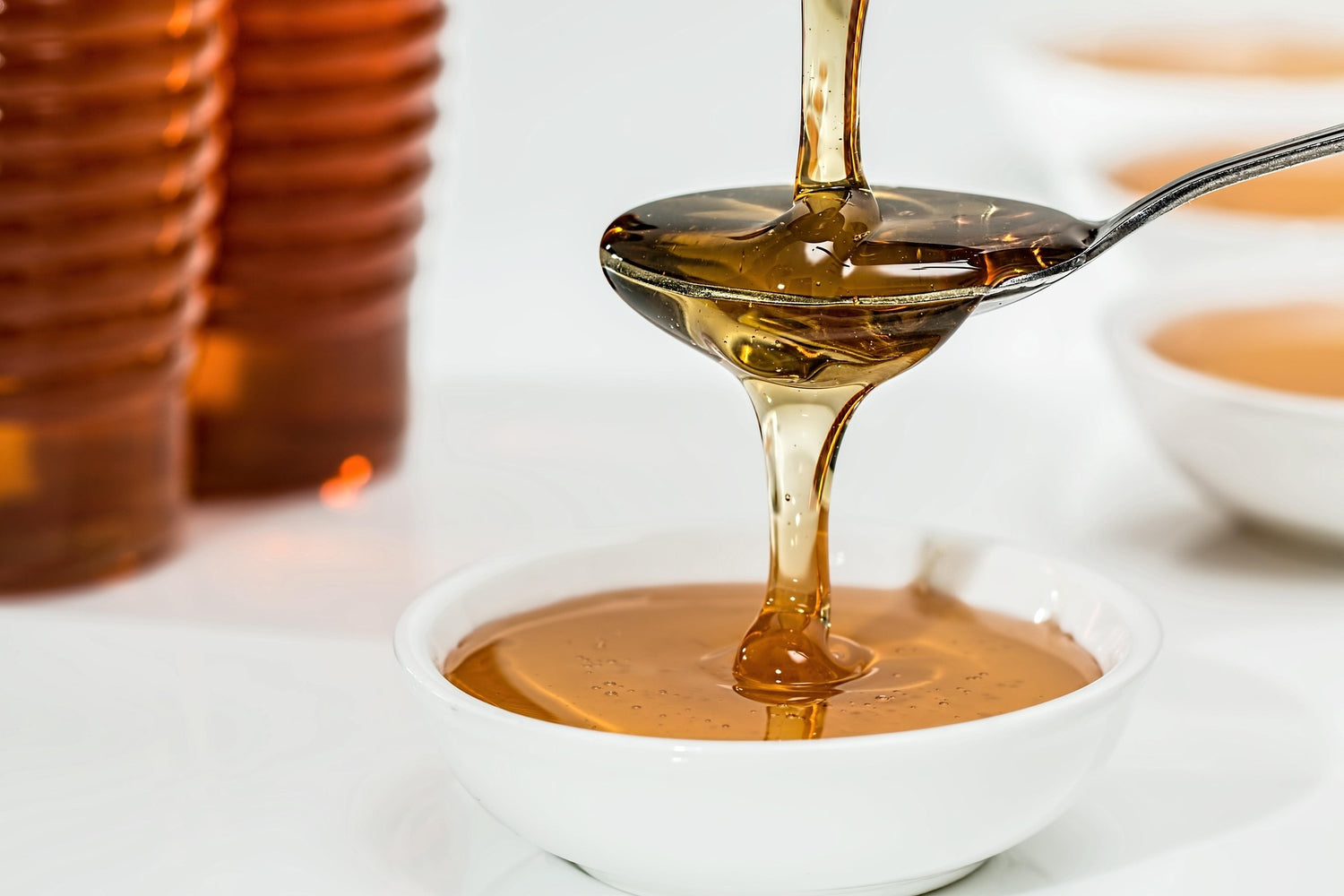 Liquid honey on a spoon